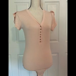 Cute soft pink bodysuit by Ella Blue size large. BNWT